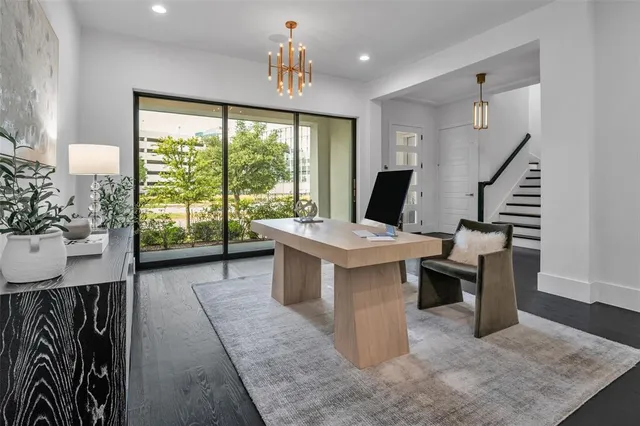 a view of a livingroom with furniture and staircase