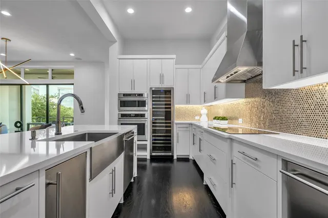 a kitchen with counter top space sink and stove