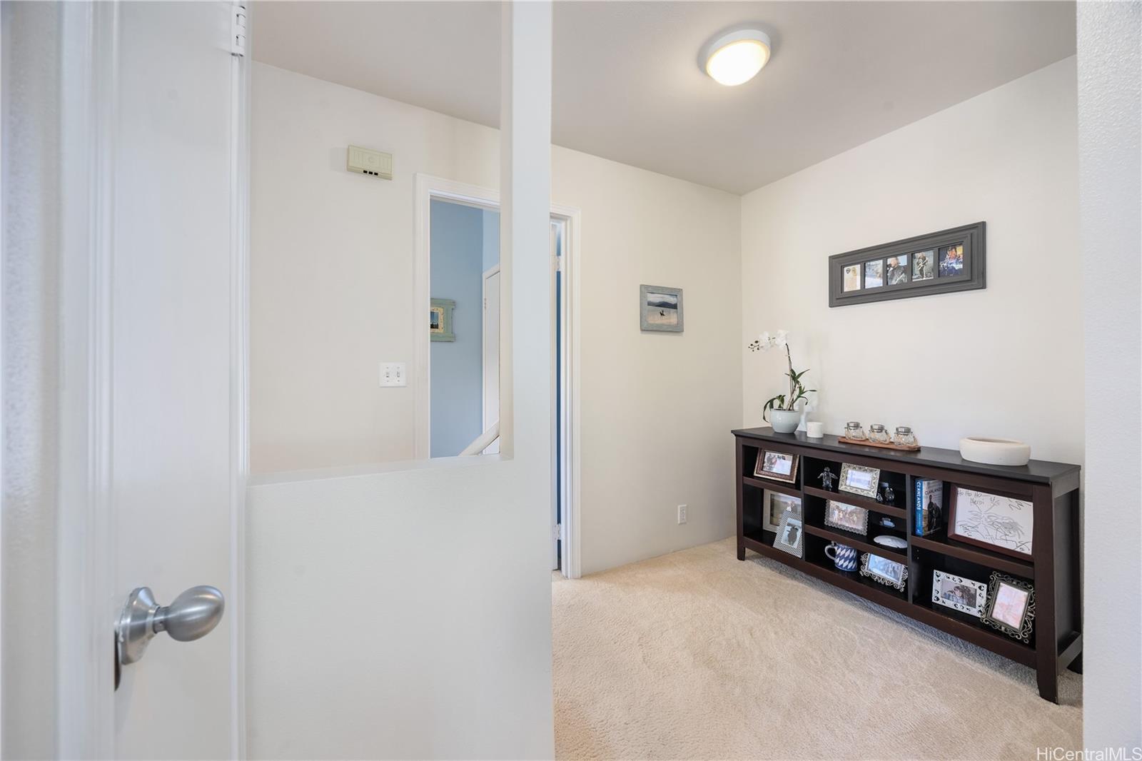 95-971 Wikao Street, Unit 11 Mililani, HI 96789 - Photo 15 of 24 a view of a livingroom with furniture