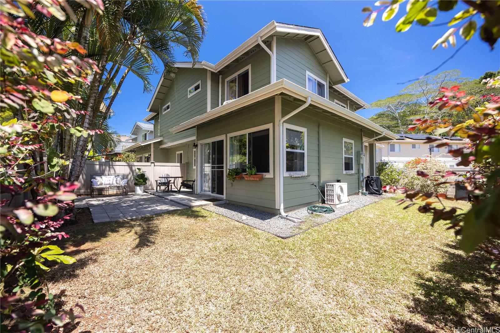 95-971 Wikao Street, Unit 11 Mililani, HI 96789 - Photo 4 of 24 a view of a house with backyard porch and sitting area