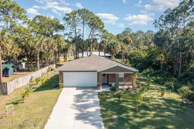 a house with trees in the background