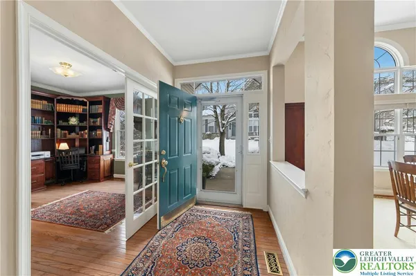 a living room with furniture and a rug