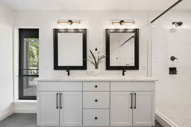 a living room with furniture a fireplace and a chandelier