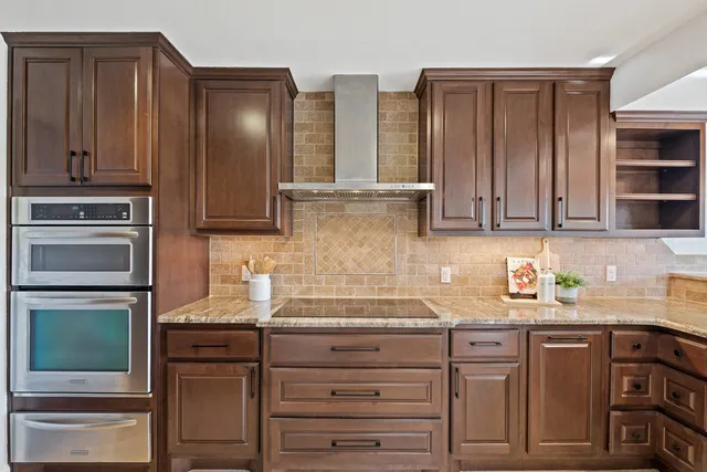 a kitchen with a sink and wooden cabinets