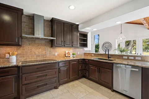 a kitchen with a sink and cabinets