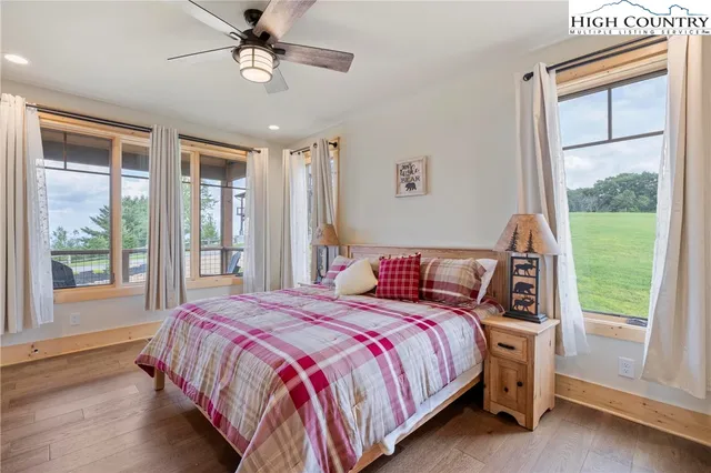 a bedroom with a large bed and a window