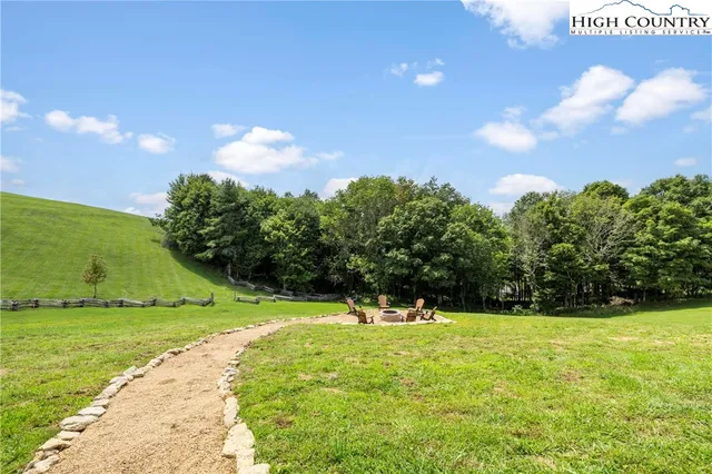 a view of outdoor space with garden and trees