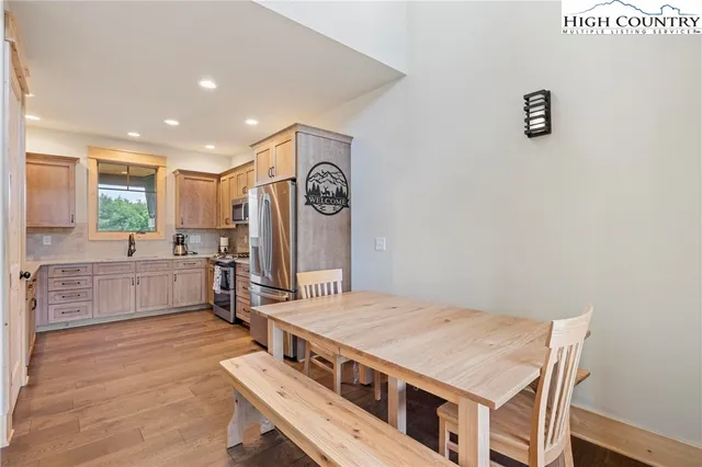 a kitchen with a stove and white cabinets