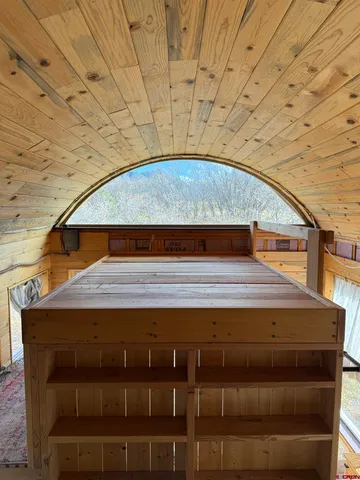 a view of backyard with a small cabin