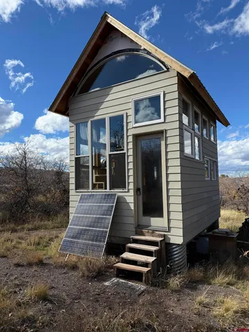 a front view of a house with stairs