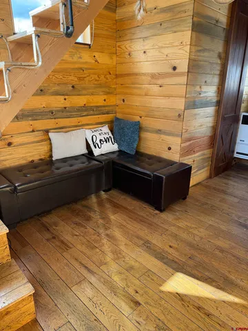 a view of room with wooden floor