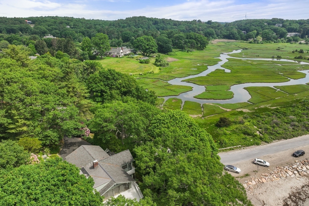 23 Ocean Street Manchester, MA 01944 - Photo 31 of 36 an aerial view of a golf course with huge green field and large trees