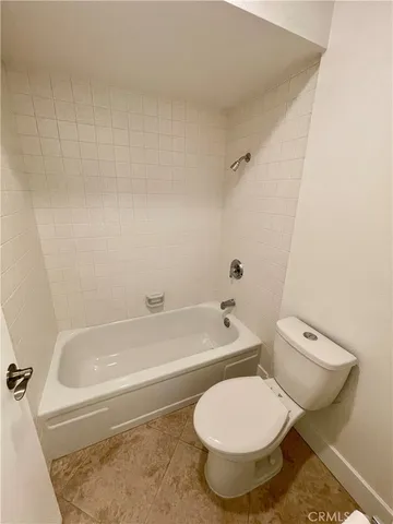 a bathroom with a granite countertop sink a mirror and vanity