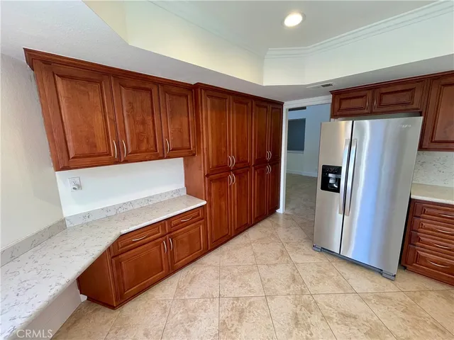 a view of kitchen with granite countertop cabinets and sink