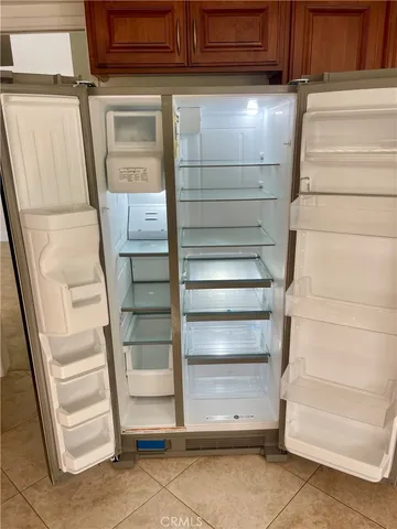 a stove top oven sitting inside of a kitchen