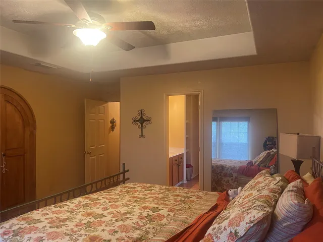 a front view of a house with a garden and yard