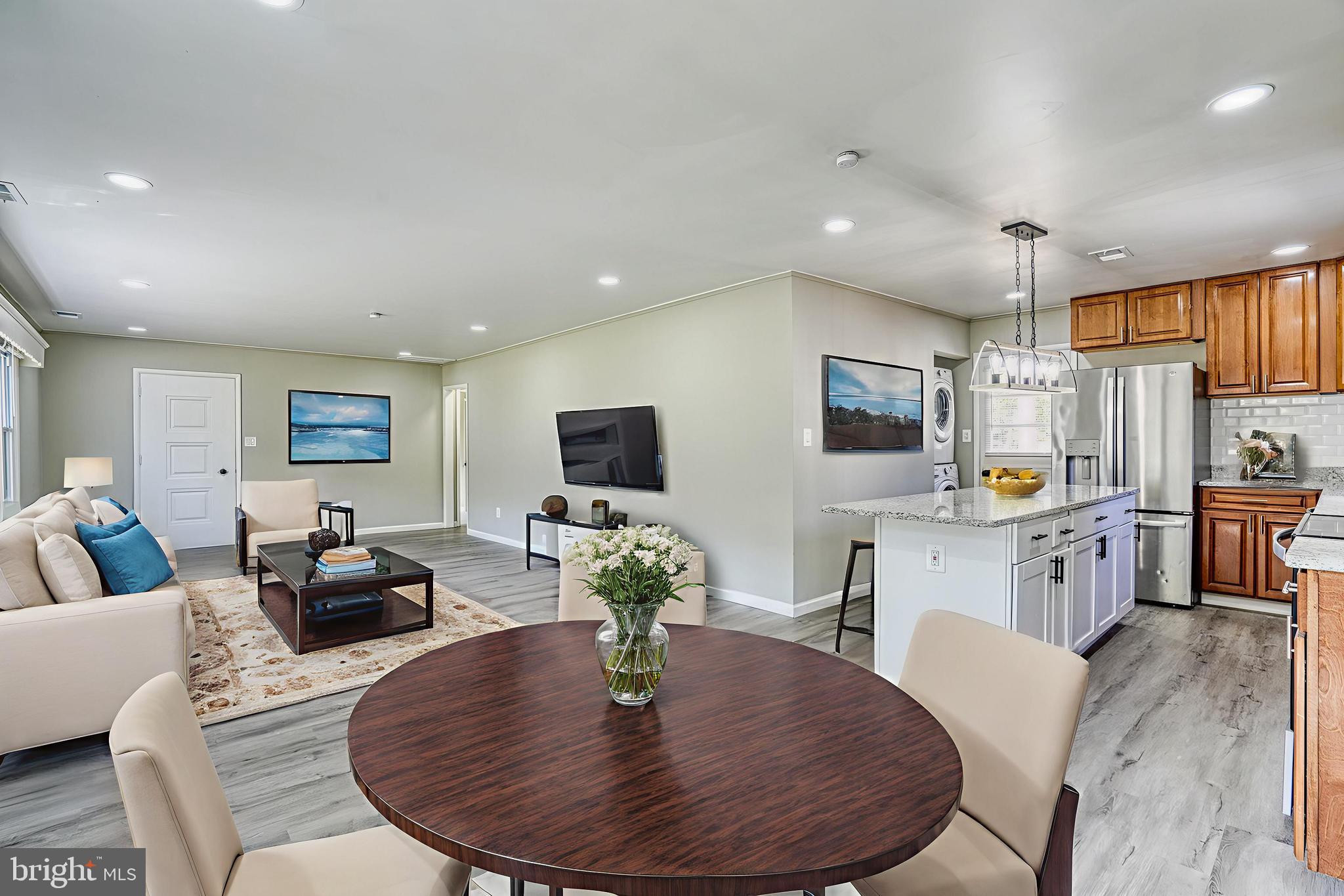 607 Edlon Park Cambridge, MD 21613 - Photo 13 of 34 a living room with furniture kitchen view and a wooden floor