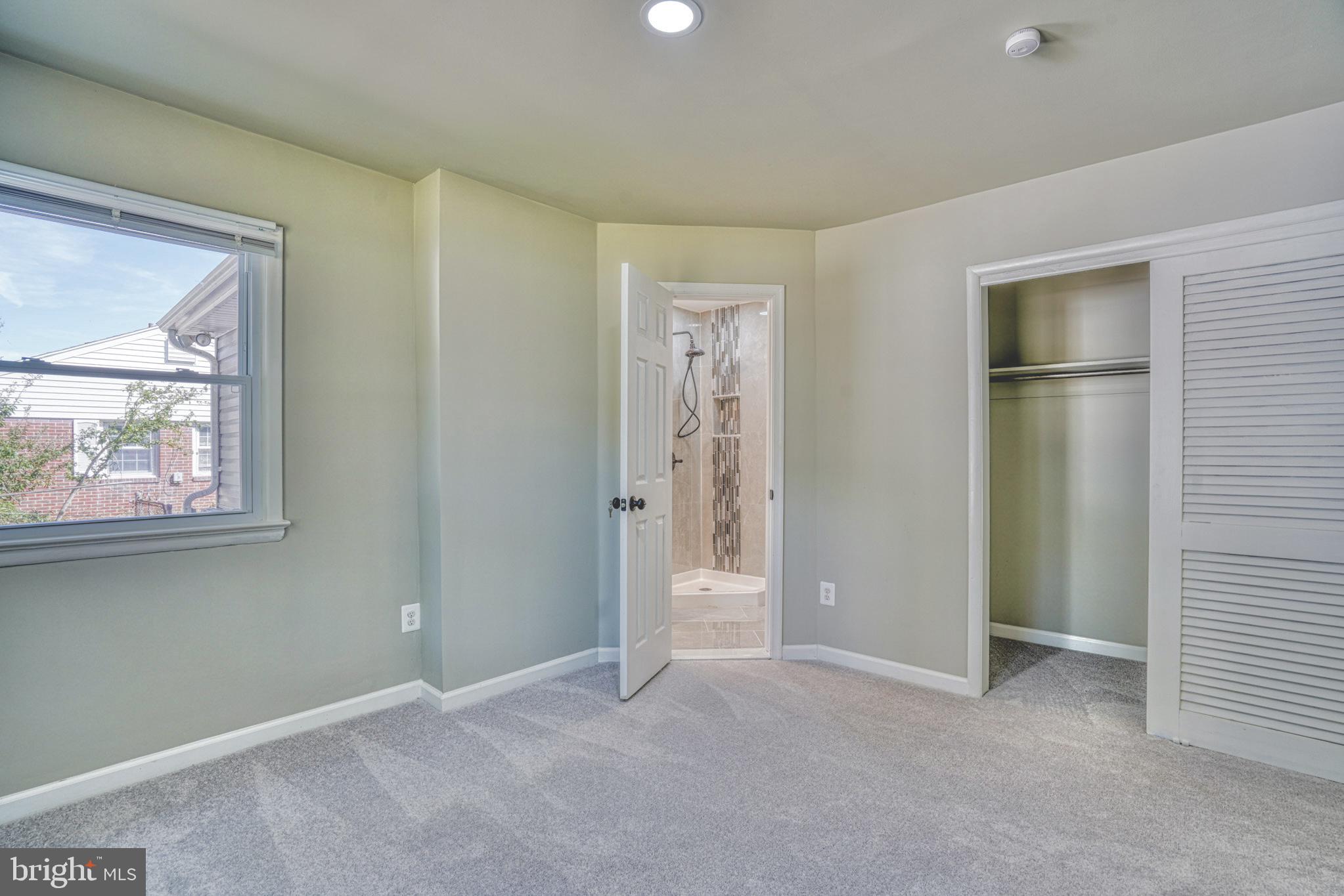 607 Edlon Park Cambridge, MD 21613 - Photo 25 of 34 an empty room with windows and closet