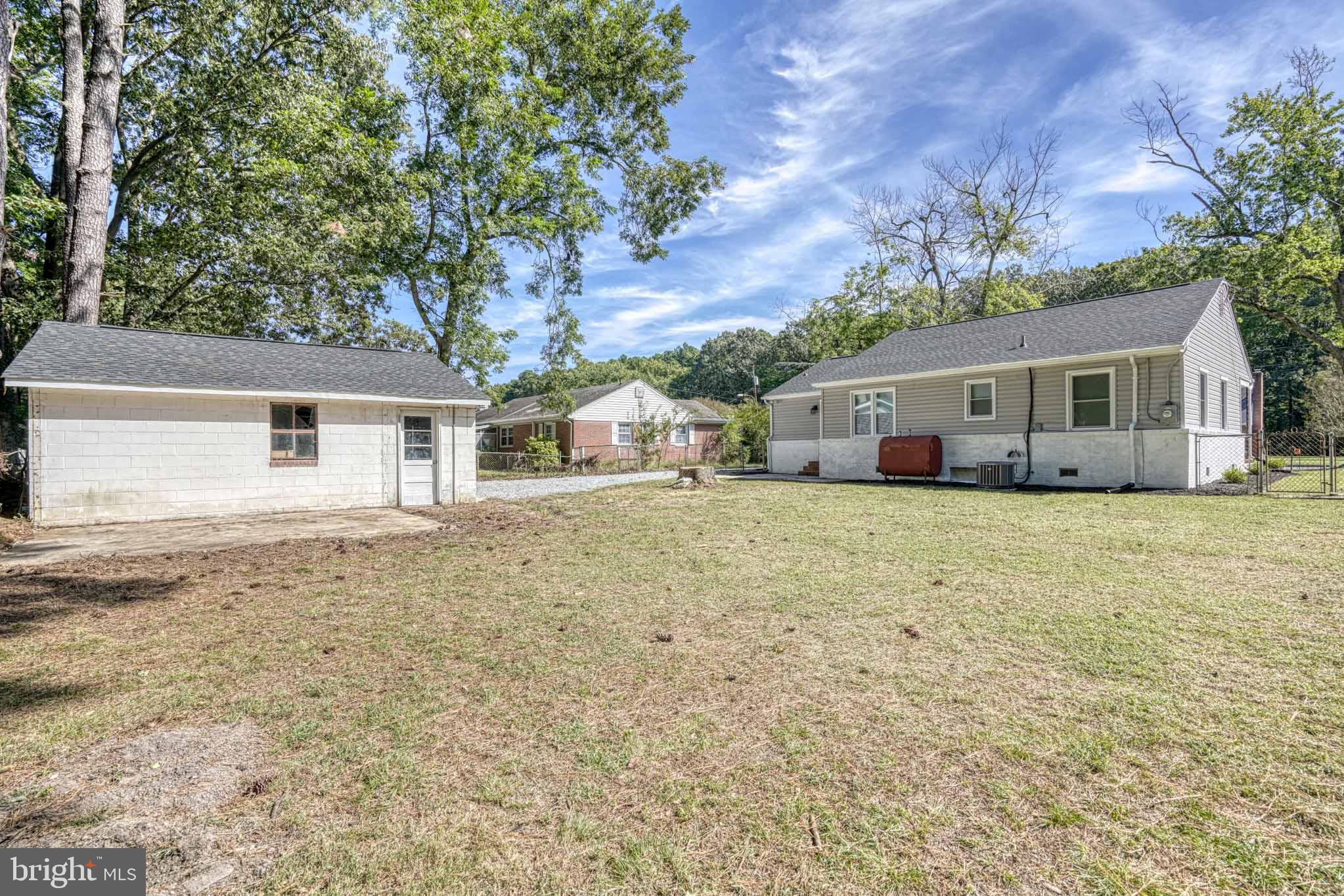 607 Edlon Park Cambridge, MD 21613 - Photo 7 of 34 a white house that has a tree in front of it