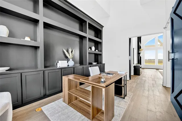 a open kitchen with stainless steel appliances kitchen island a stove a refrigerator cabinets and living room view