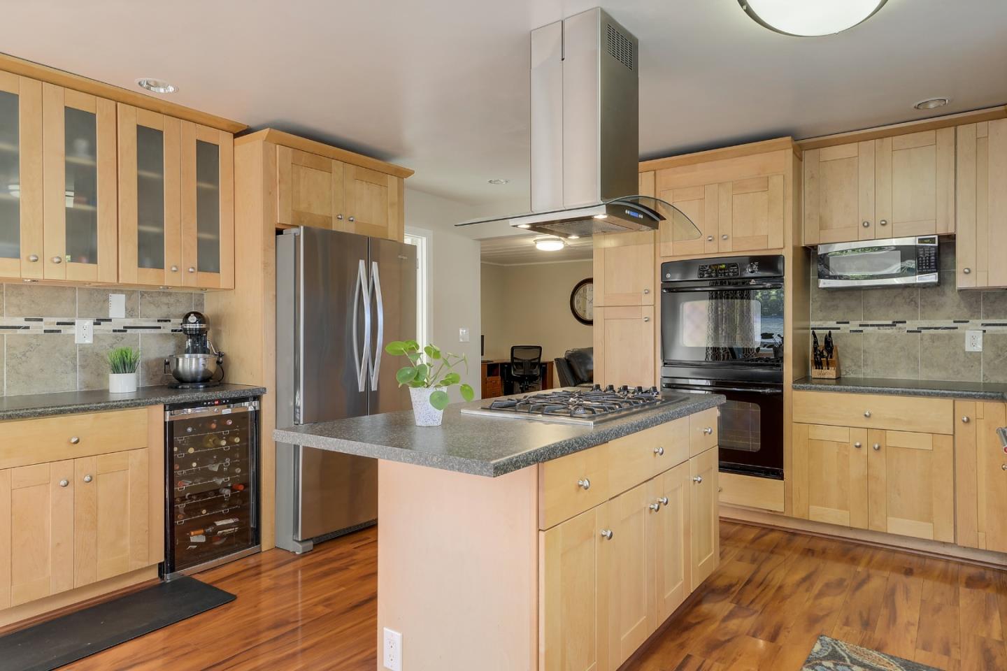 22620 Ricardo Road Cupertino, CA 95014 - Photo 12 of 34 a kitchen with stainless steel appliances granite countertop a stove a sink and a refrigerator