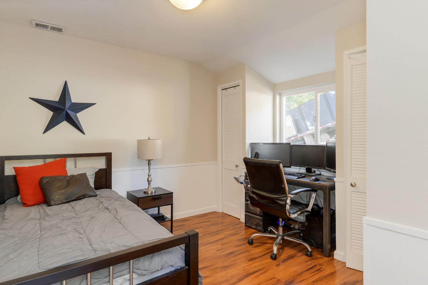 22620 Ricardo Road Cupertino, CA 95014 - Photo 19 of 34 a bedroom with a bed and a workspace