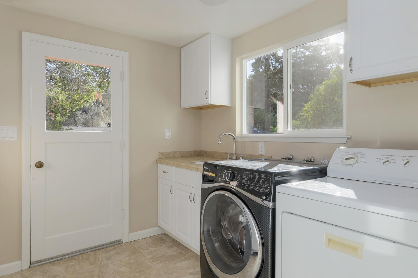 22620 Ricardo Road Cupertino, CA 95014 - Photo 21 of 34 a utility room with dryer and washer