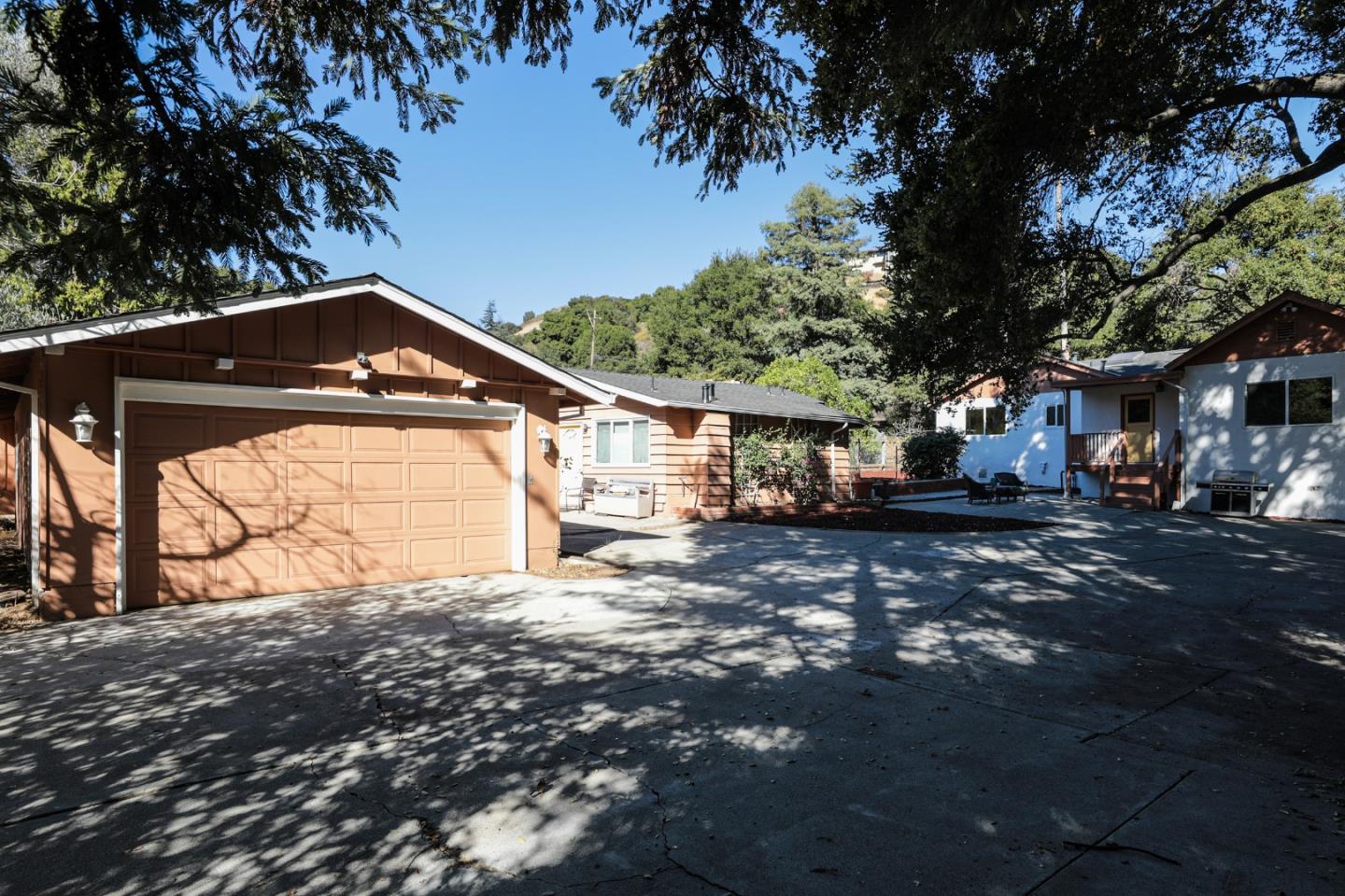 22620 Ricardo Road Cupertino, CA 95014 - Photo 25 of 34 a front view of a house with a yard