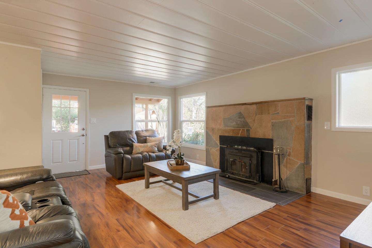 22620 Ricardo Road Cupertino, CA 95014 - Photo 5 of 34 a living room with furniture a fireplace and a window