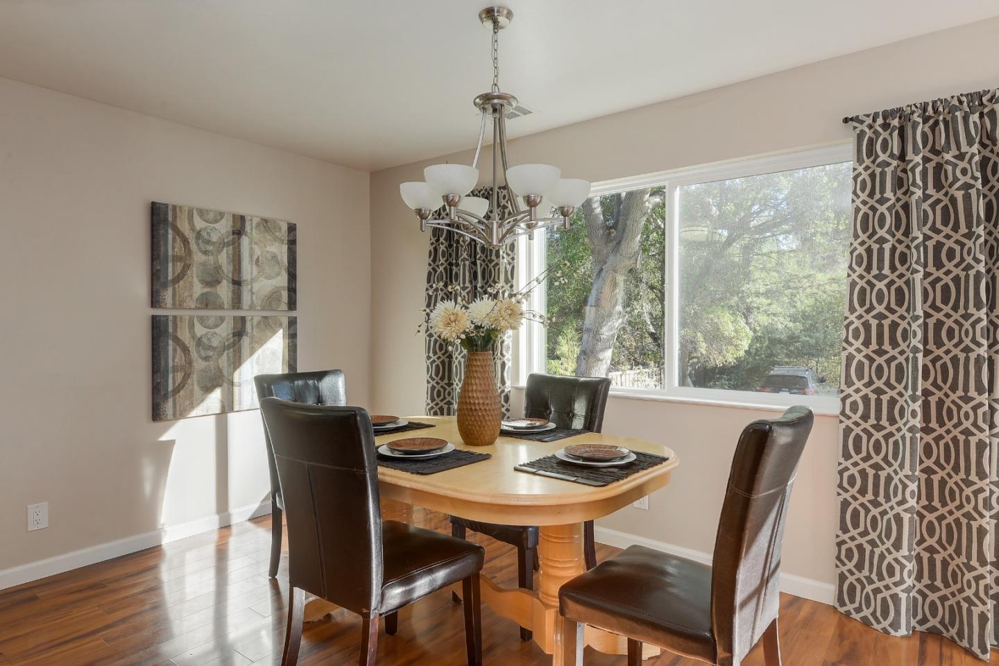 22620 Ricardo Road Cupertino, CA 95014 - Photo 8 of 34 a view of a dining room with furniture window and wooden floor