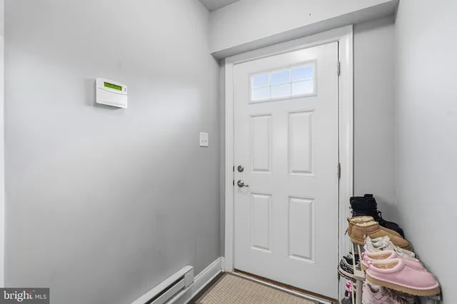 a view of room with hallway and closet