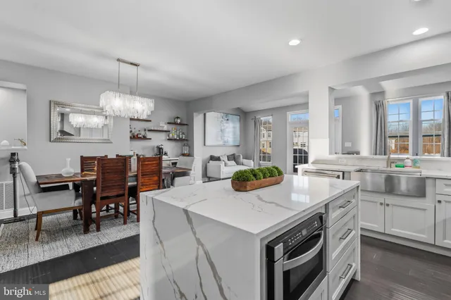 a view of kitchen island dining table and chairs