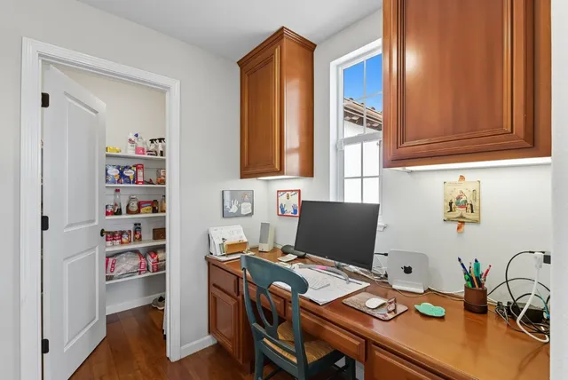a view of a workspace with furniture