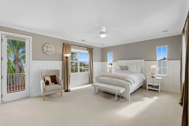 a bed room with a bed and a chair