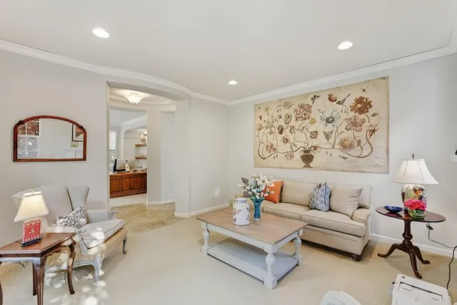 a living room with furniture and a painting