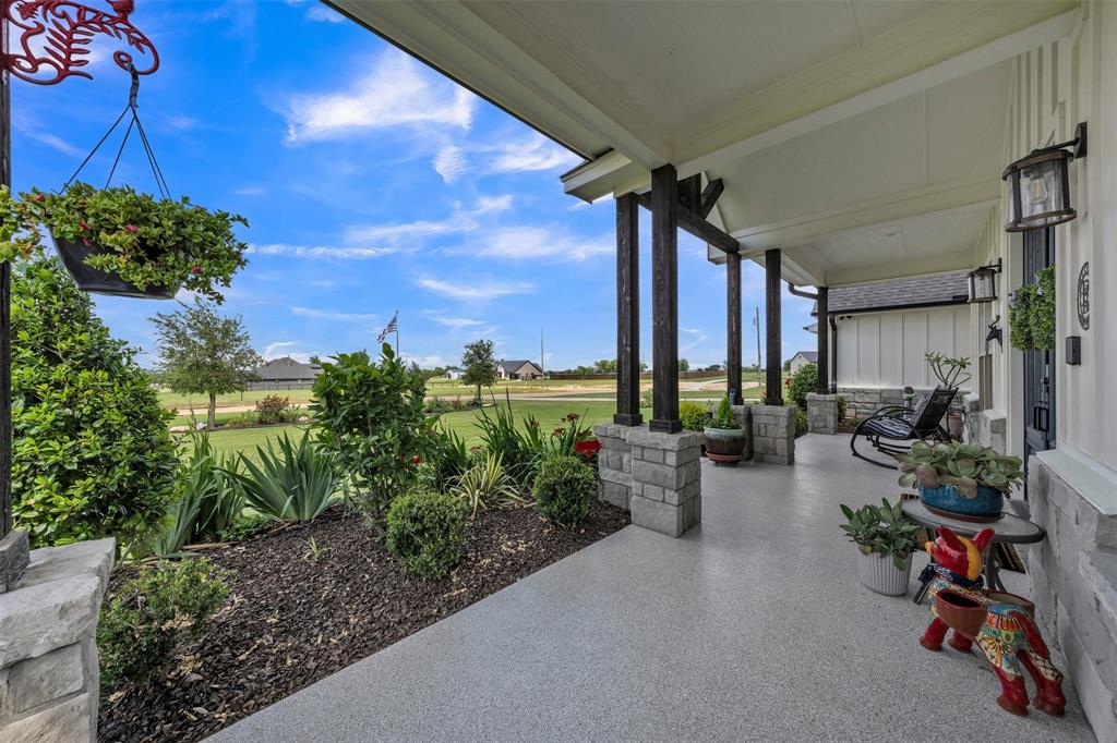 6628 Buffalo Ridge Circle Godley, TX 76044 - Photo 5 of 39 a view of a porch with potted plants