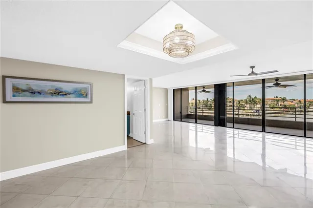 a view of an empty room with a floor to ceiling window