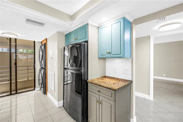 a kitchen with stainless steel appliances granite countertop a refrigerator sink and cabinets