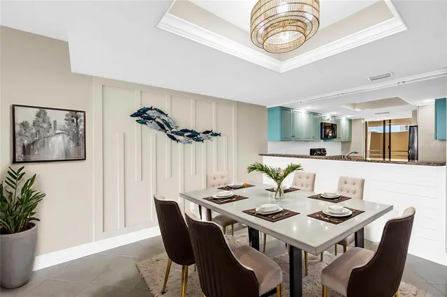 a view of a balcony with dining table and chairs