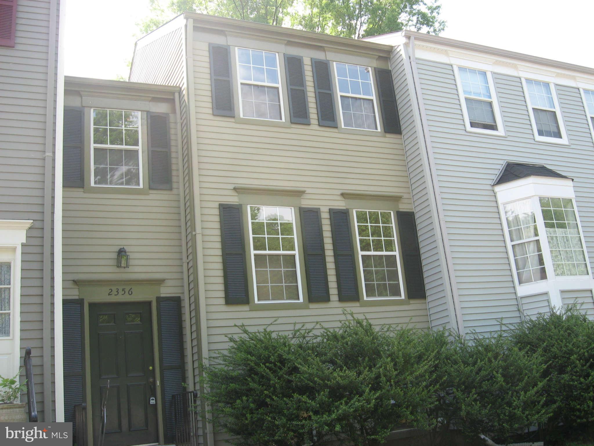 2356 Hunters Square Court, Unit 2356 Reston, VA 20191 - Photo 1 of 27 a view of a house with more windows and brick walls