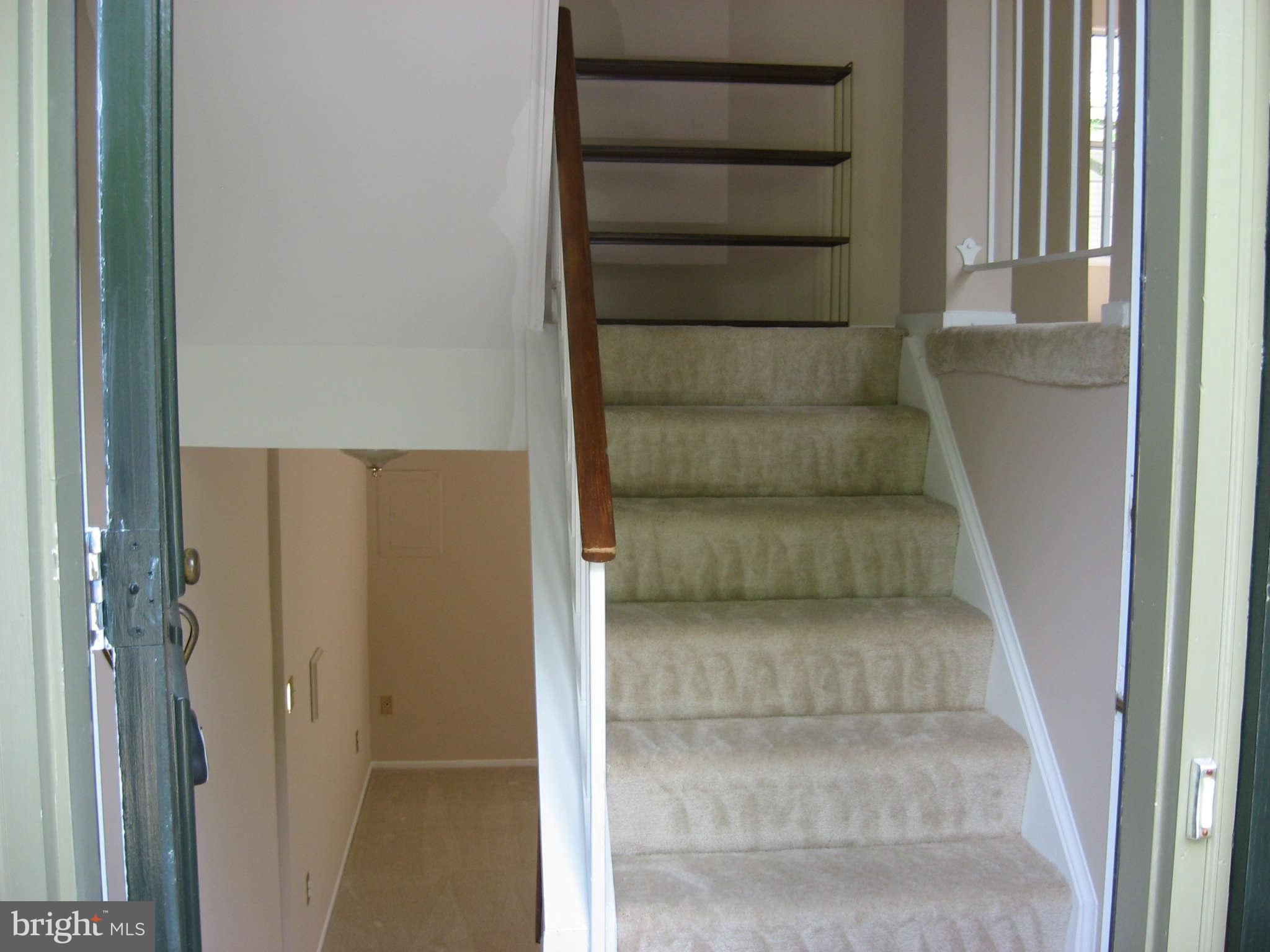2356 Hunters Square Court, Unit 2356 Reston, VA 20191 - Photo 12 of 27 a view of staircase with white walls