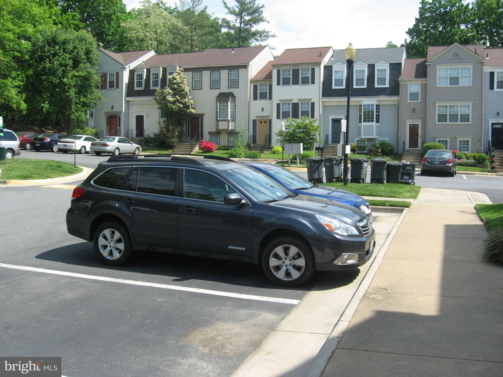 2356 Hunters Square Court, Unit 2356 Reston, VA 20191 - Photo 23 of 27 a view of a car parked in front of a brick house