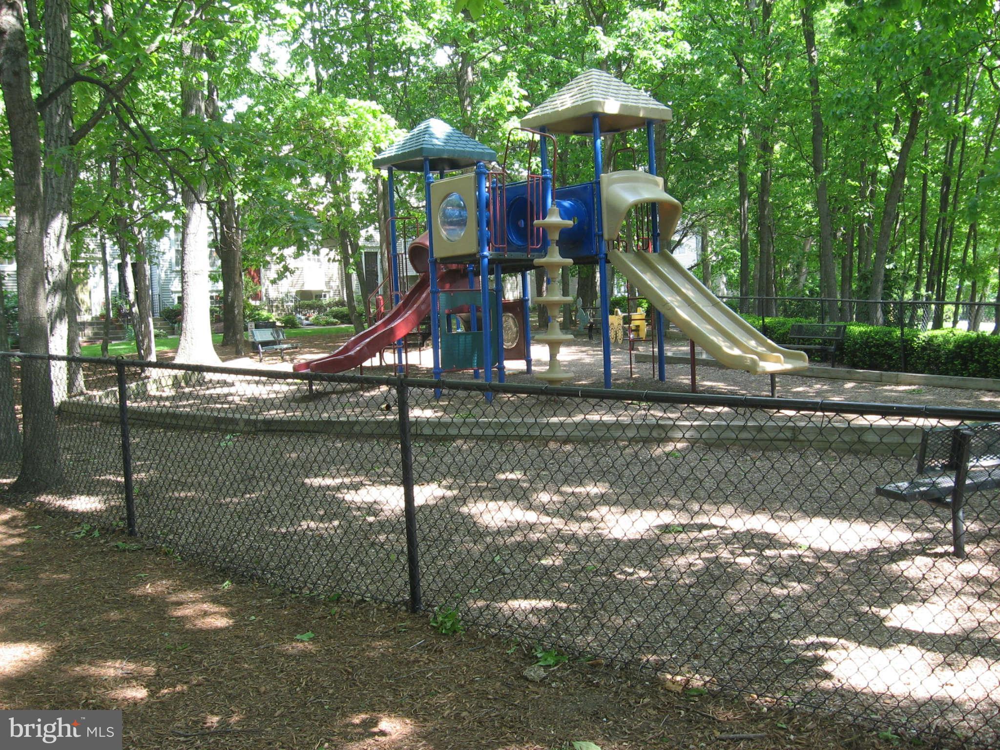 2356 Hunters Square Court, Unit 2356 Reston, VA 20191 - Photo 24 of 27 a view of a lake with a park