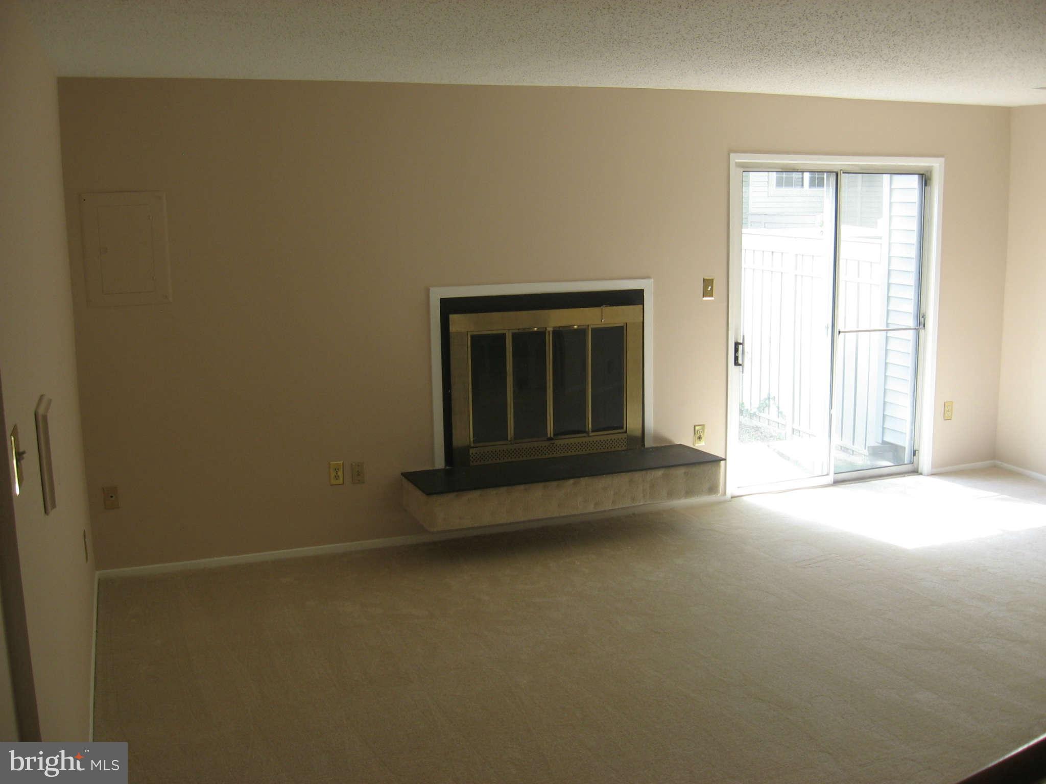 2356 Hunters Square Court, Unit 2356 Reston, VA 20191 - Photo 4 of 27 an empty room with windows