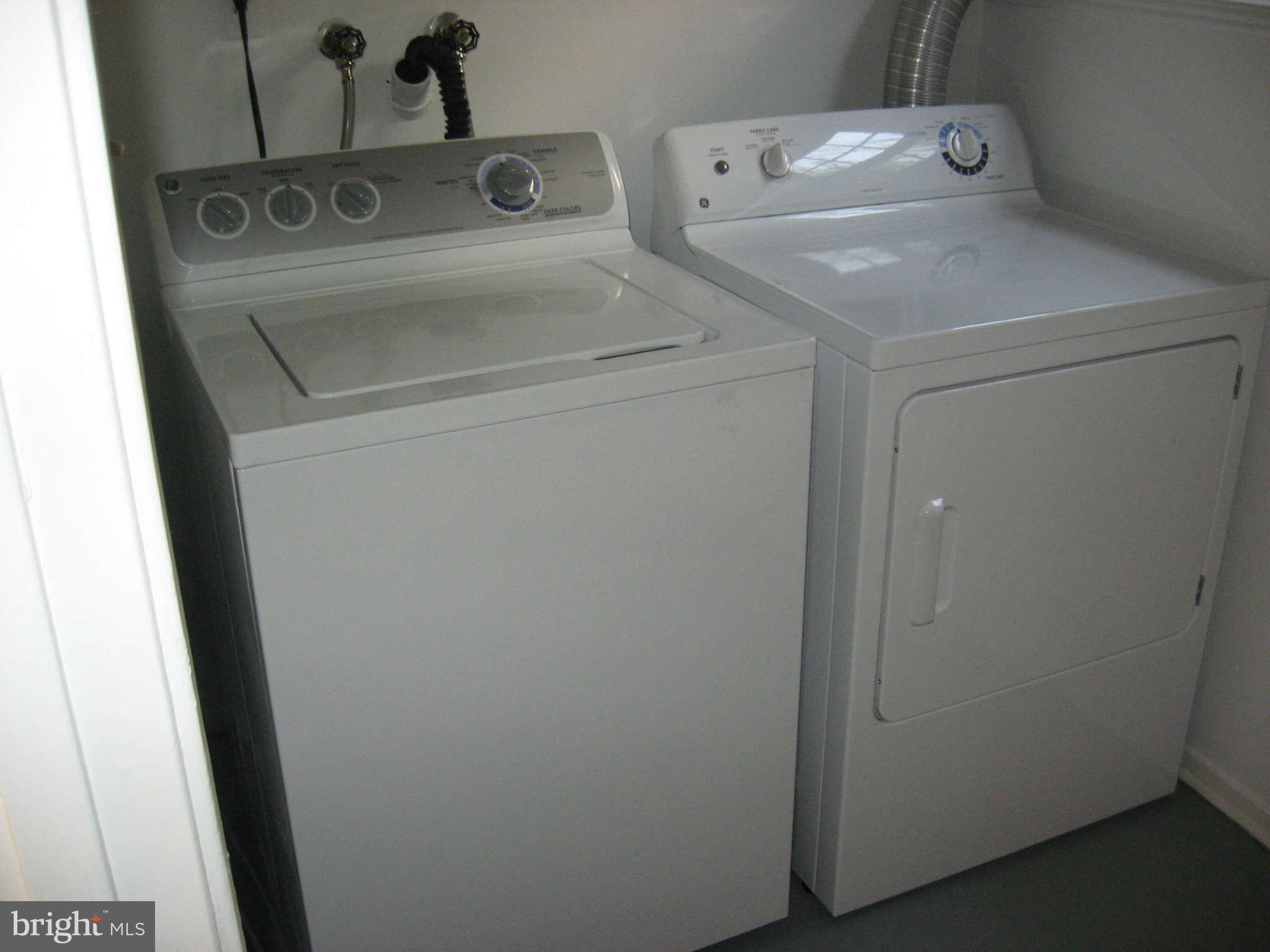 2356 Hunters Square Court, Unit 2356 Reston, VA 20191 - Photo 5 of 27 a utility room with dryer and washer