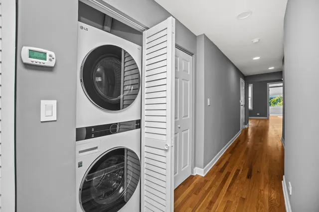 a view of a hallway with washer and dryer
