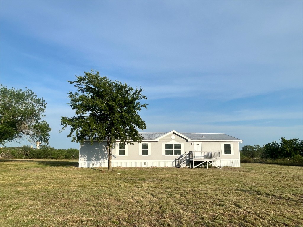 109 Appaloosa Way Kyle, TX 78640 - Photo 1 of 11 a front view of a house with a yard