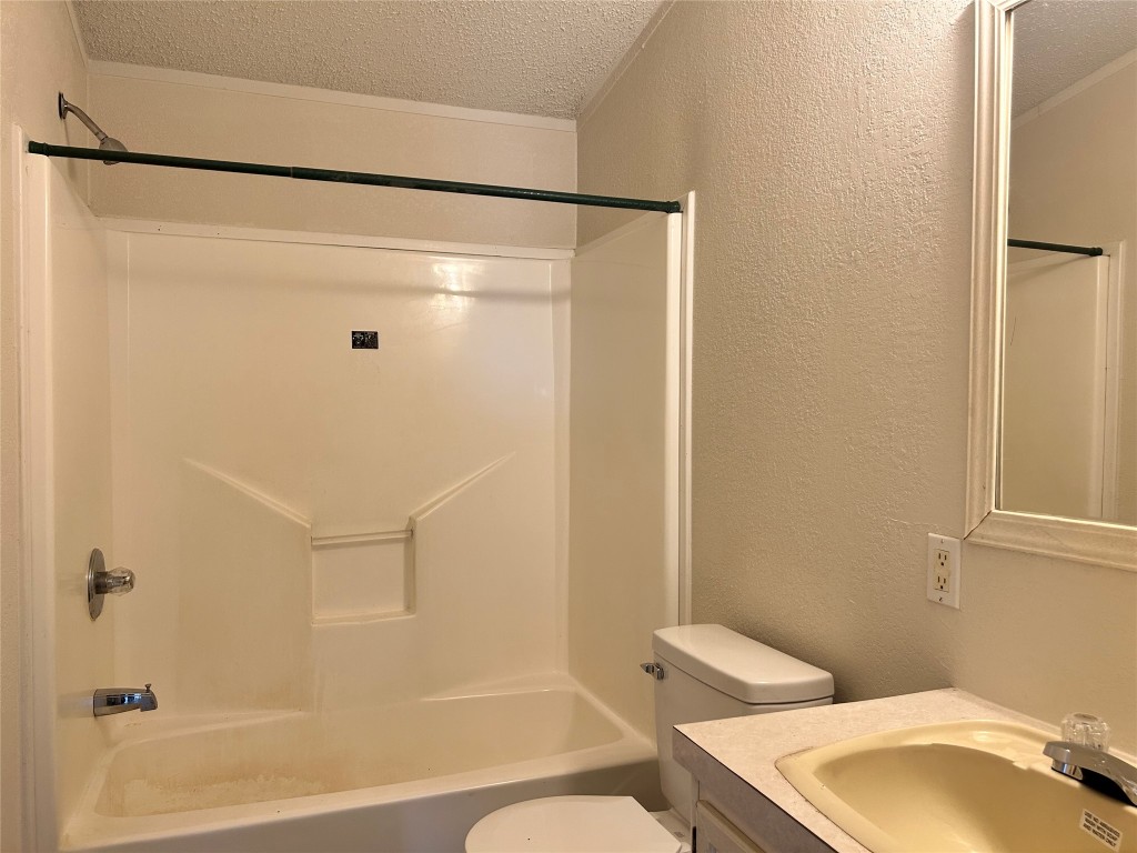 109 Appaloosa Way Kyle, TX 78640 - Photo 9 of 11 a bathroom with a shower and a toilet