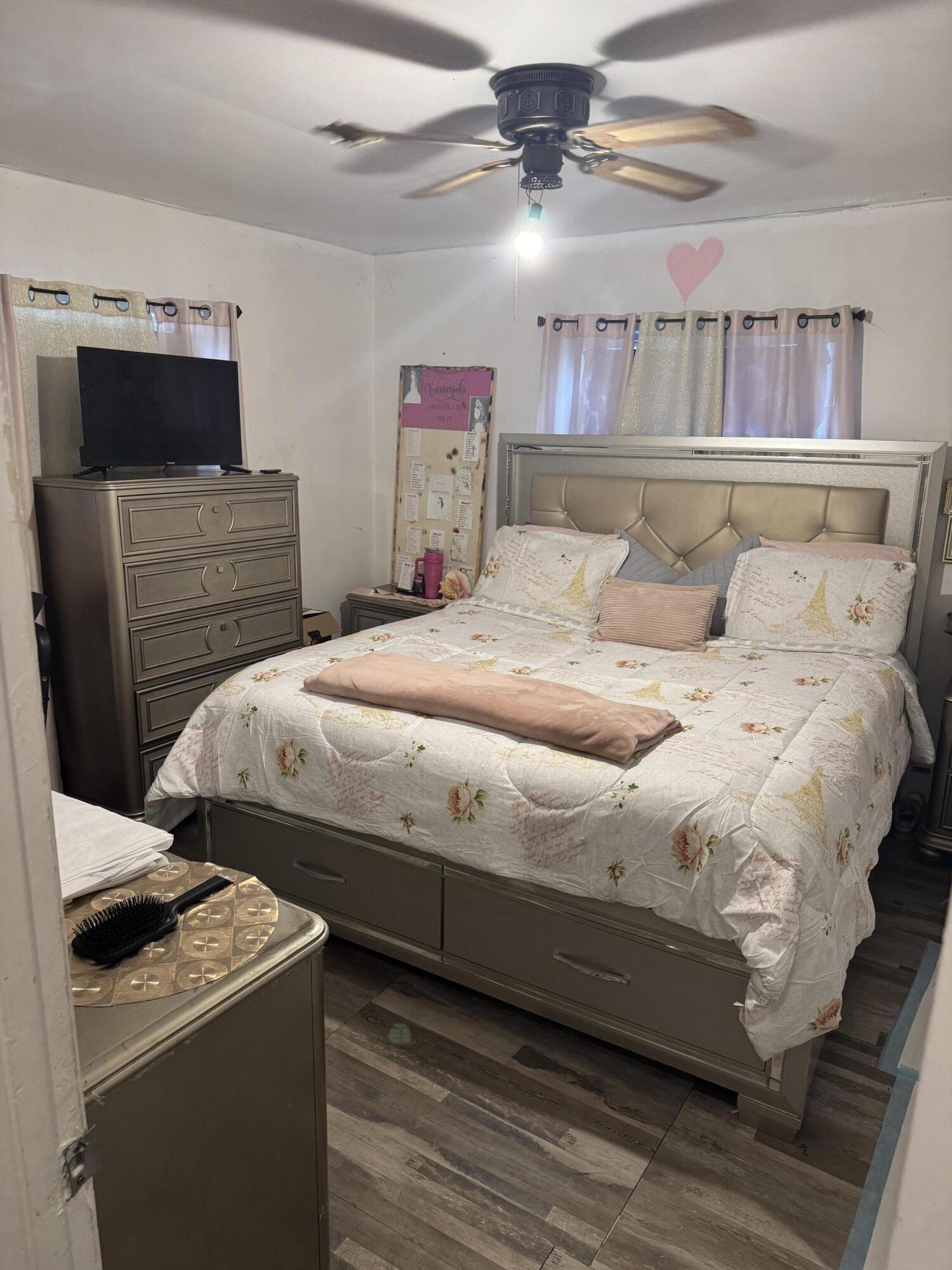 1017 Northwest 47th Street Miami, FL 33127 - Photo 5 of 18 a bedroom with a bed and a television