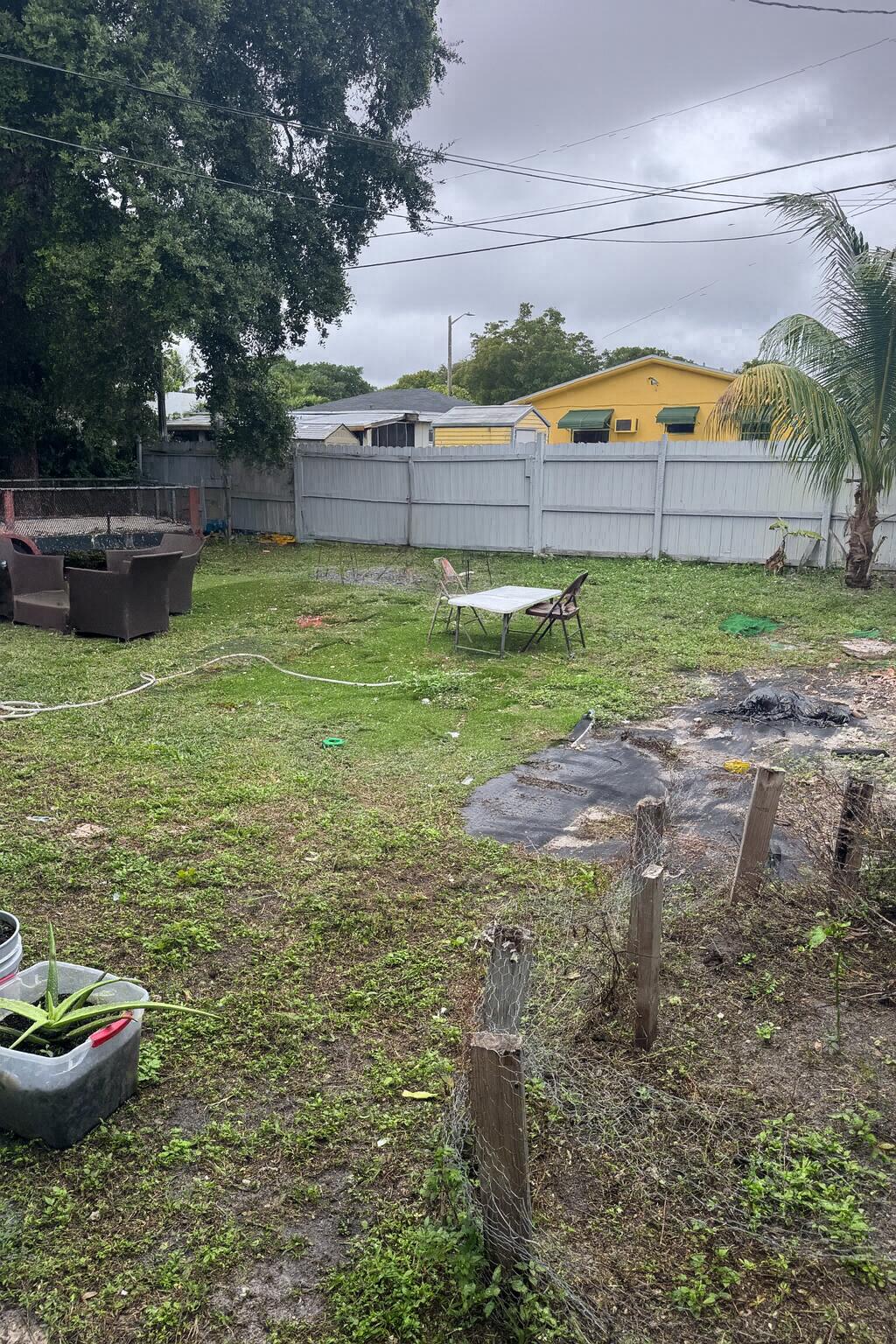 1017 Northwest 47th Street Miami, FL 33127 - Photo 9 of 18 a view of a backyard with swimming pool